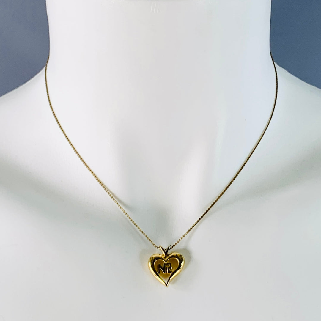 NINA RICCI Gold Metal Heart Monogram Pendant Necklace