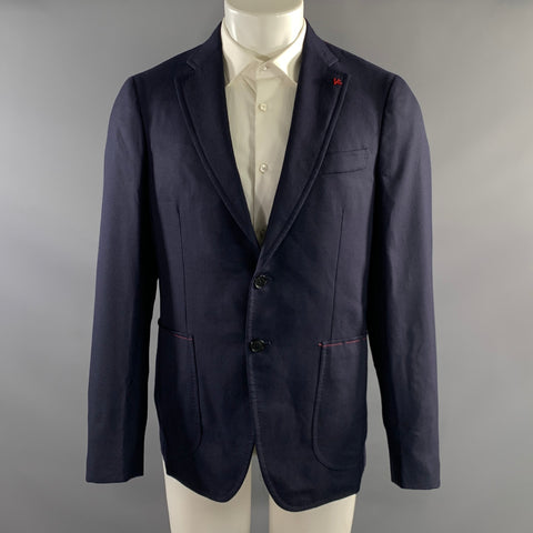 Front view of navy Isaia two-button sport coat on mannequin with red stitched pocket accents and red lapel pin.