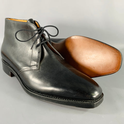 Black leather ankle boot shown beside its tan leather interior.