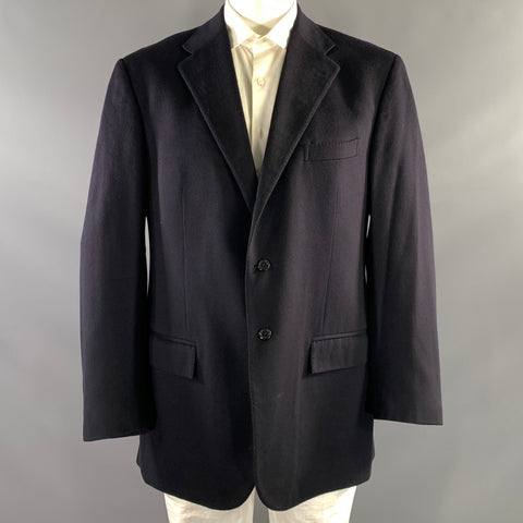 Front view of black Polo by Ralph Lauren notch-lapel sport coat on a mannequin, with two-button front and flap pockets.