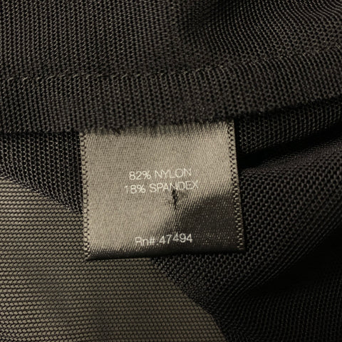 Close-up of fabric content label stating 82% nylon and 18% spandex.