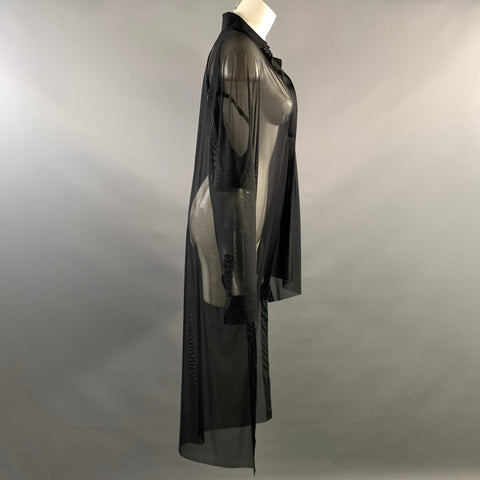 Side view of black sheer mesh long-sleeve tunic shirt on a mannequin.