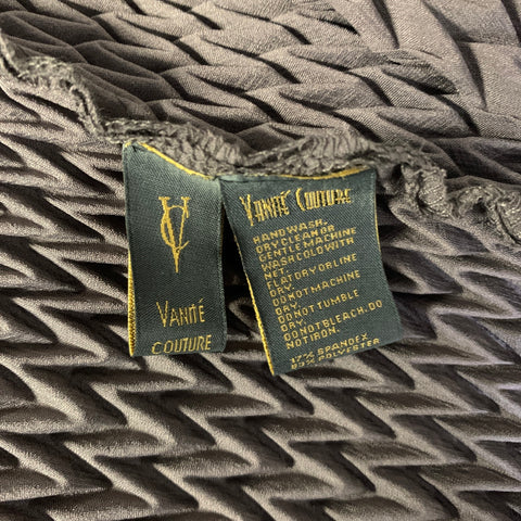 Close-up of VANITE COUTURE label and care label showing 17% spandex and 83% polyester.