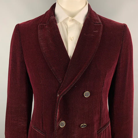 Close front view showing the sport coat lapels, double-breasted buttons, and breast pocket.