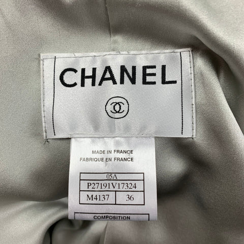 Close-up of the garment composition label listing nylon, silk, viscose, wool, polyester, and silk lining.