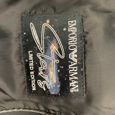Interior Limited Edition Emporio Armani patch with illustrated figure and colorful speckled design.