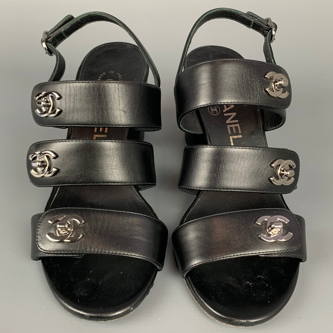 CHANEL Size 6 Black & Silver Leather Turn Lock Logo Chunky Heel Sandals