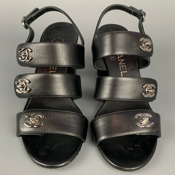 CHANEL Size 6 Black & Silver Leather Turn Lock Logo Chunky Heel Sandals