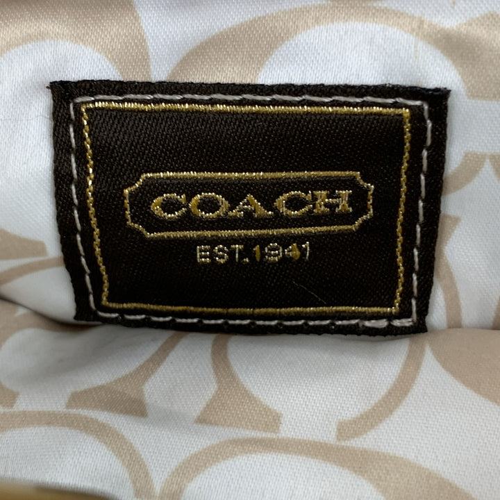 COACH Bolso clutch de cuero dorado