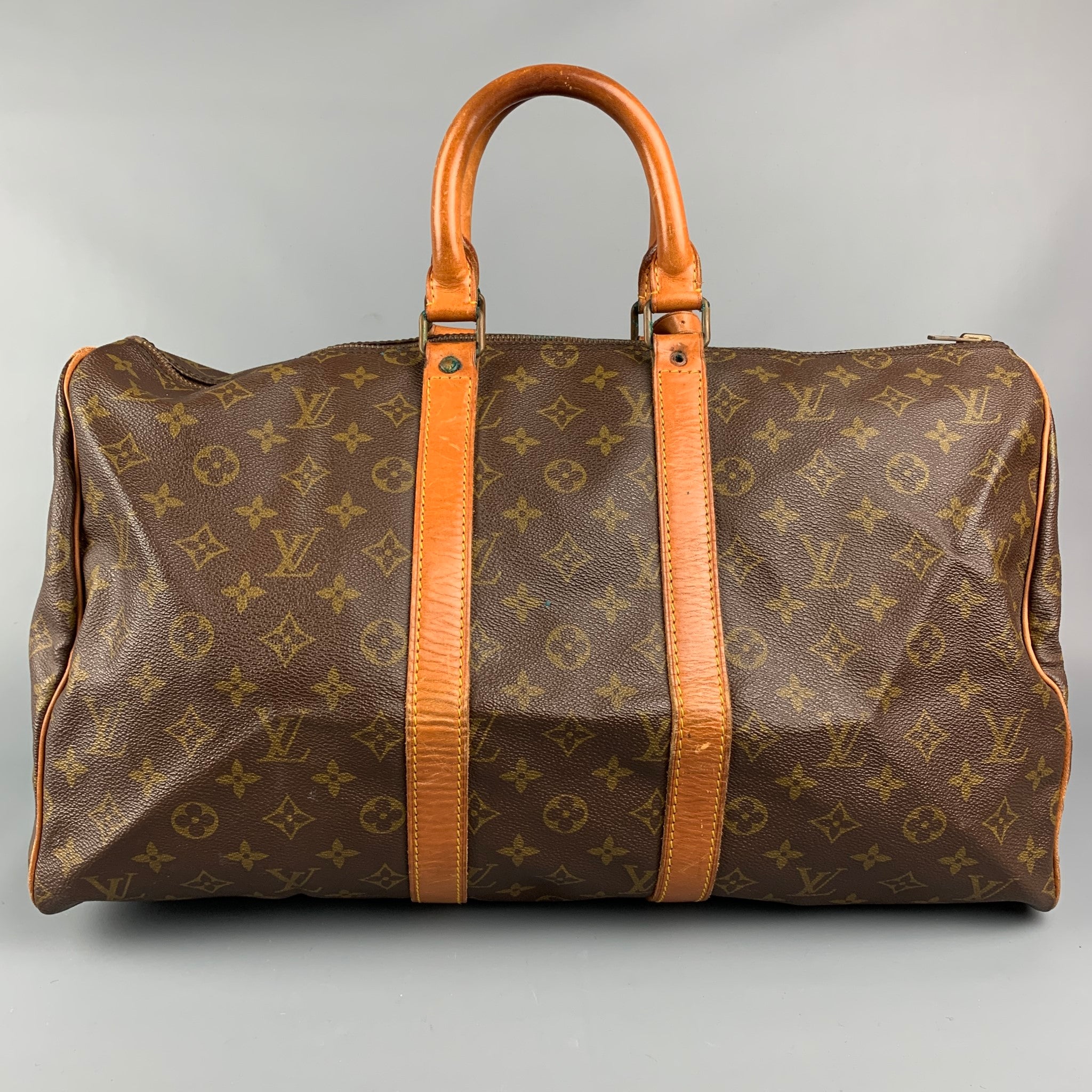 LOUIS VUITTON Brown Monogram Coated Canvas and Vachetta Leather Vintage  Keepall 45 For Sale at 1stDibs