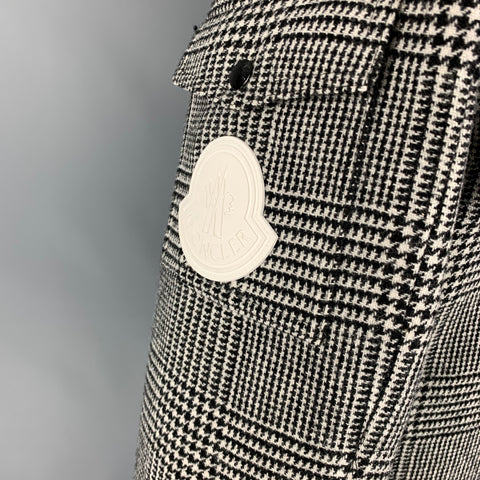 Close-up of the white Moncler logo patch on the jacket sleeve.
