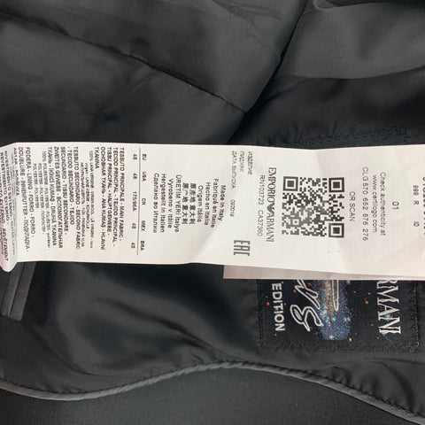Interior care label showing Emporio Armani QR code, Made in Italy text, size 48, and fabric information.