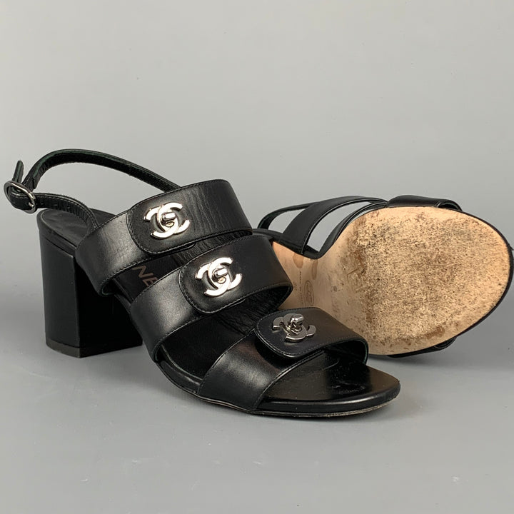CHANEL Size 6 Black & Silver Leather Turn Lock Logo Chunky Heel Sandals