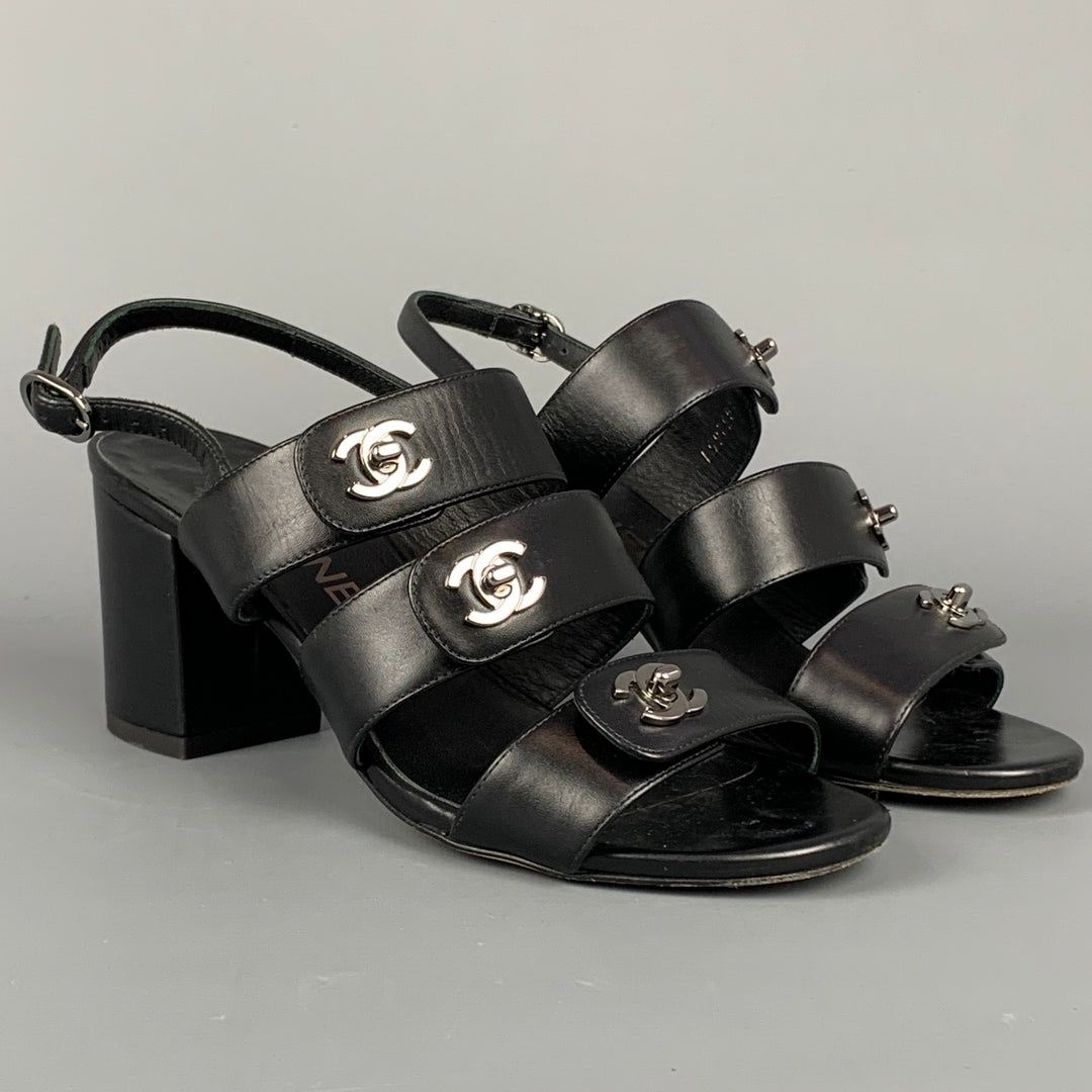 CHANEL Size 6 Black & Silver Leather Turn Lock Logo Chunky Heel Sandals