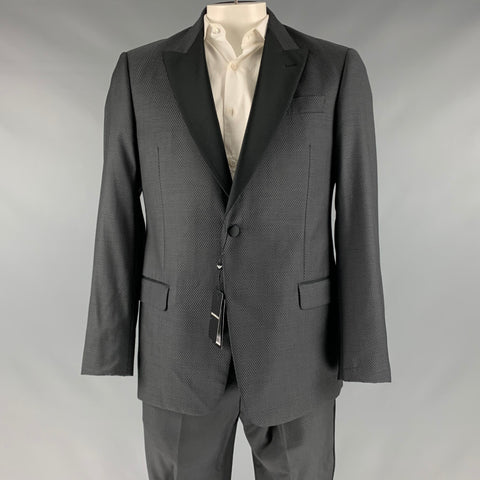 Close front view of grey and black woven Emporio Armani tuxedo jacket on mannequin, with black peak lapels and one button.