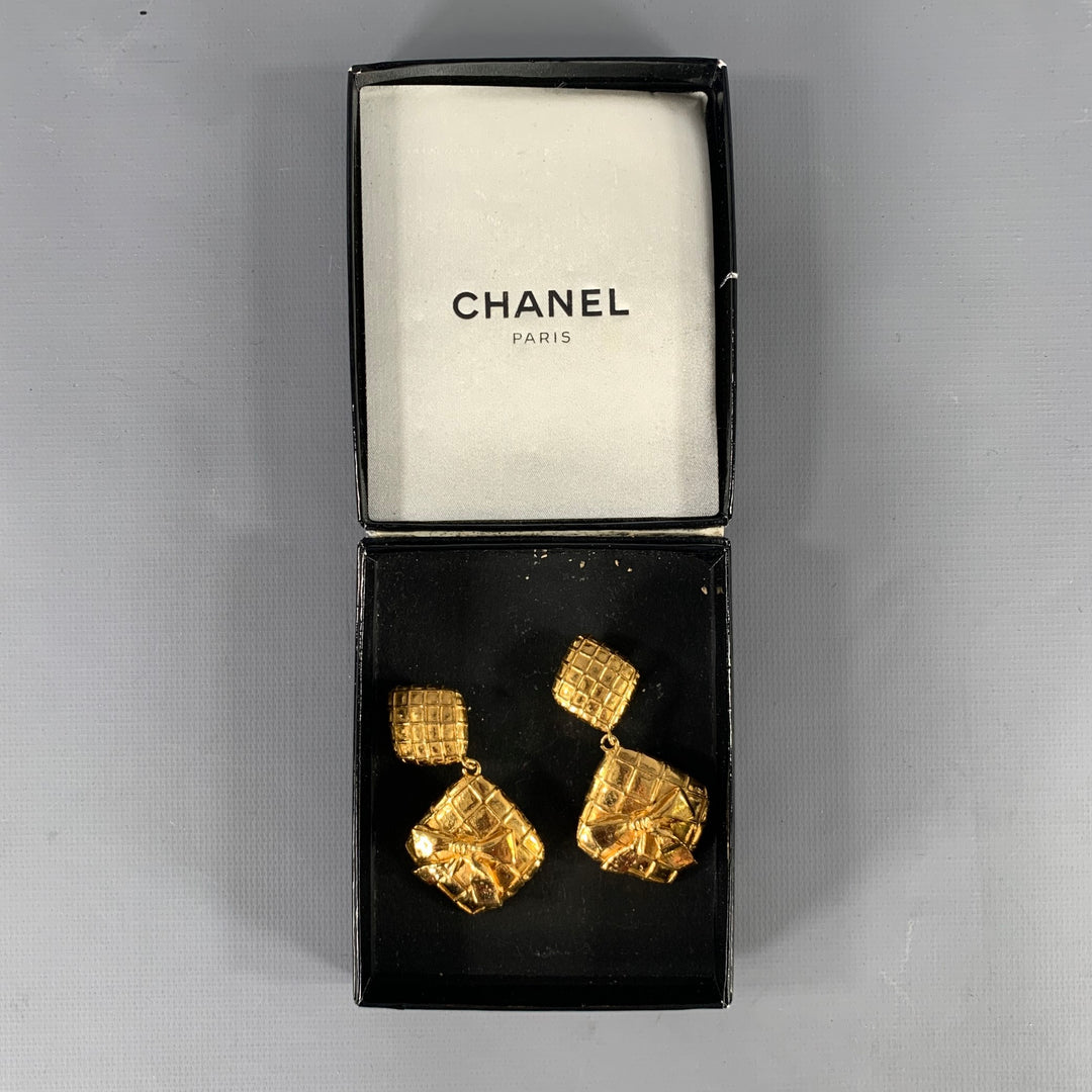 CHANEL Gold Tone Diamond Logo Clip-On Earrings