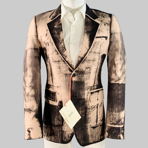 A notch lapel sport coat featuring a pink and black x-ray print, with a double button closure and a tag visible.