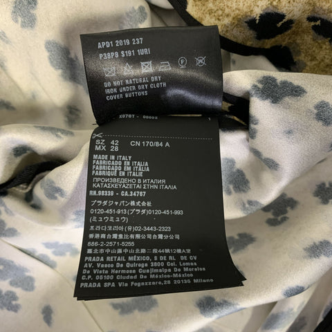 PRADA Robe longue beige et noire en viscose à drapé asymétrique, taille 38