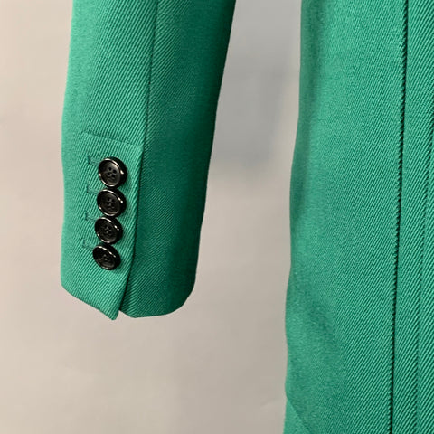 Costume AMI by ALEXANDRE MATTIUSSI en laine verte à revers crantés, taille 38