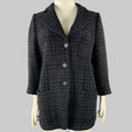 A CHANEL black and navy cotton blend coat with 3/4 sleeves and button closure, displayed on a mannequin.