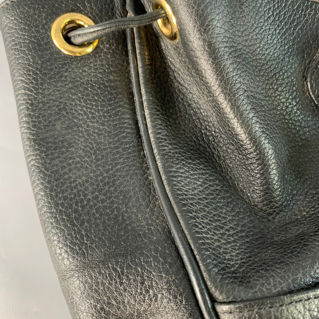 MCM Vintage Small Black Gold Leather Drawstring Backpack  display picture 1