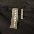 Close-up of Norma Kamali size S/36 and Made in China labels.