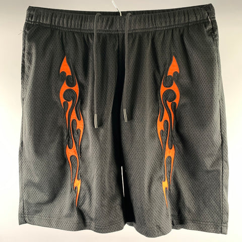 Short athlétique en polyester PLEASURES taille M, noir, motifs flammes orange