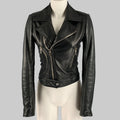 Black leather jacket on a mannequin against a gray background