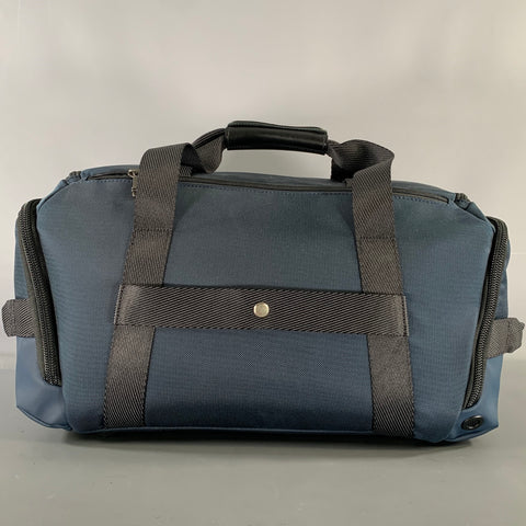 Sacs polochons en toile chinée noire bleu marine TUMI
