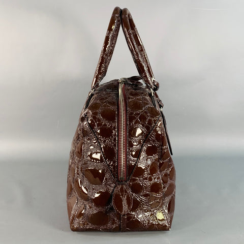 Sac à main ALAIA en cuir verni embossé marron avec anses et bandoulière
