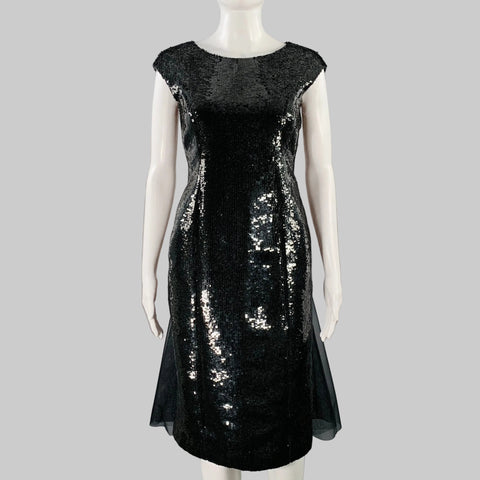 A black wool silk sequined shift dress with a sheer back and a tulle train, size 2.