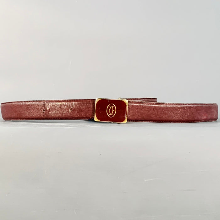 Ceinture fine CARTIER Vintage en cuir bordeaux et logo doré - Taille 43