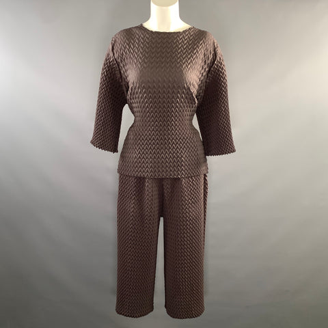 Front full view of brown chevron-pleated top and wide-leg pants set on mannequin.