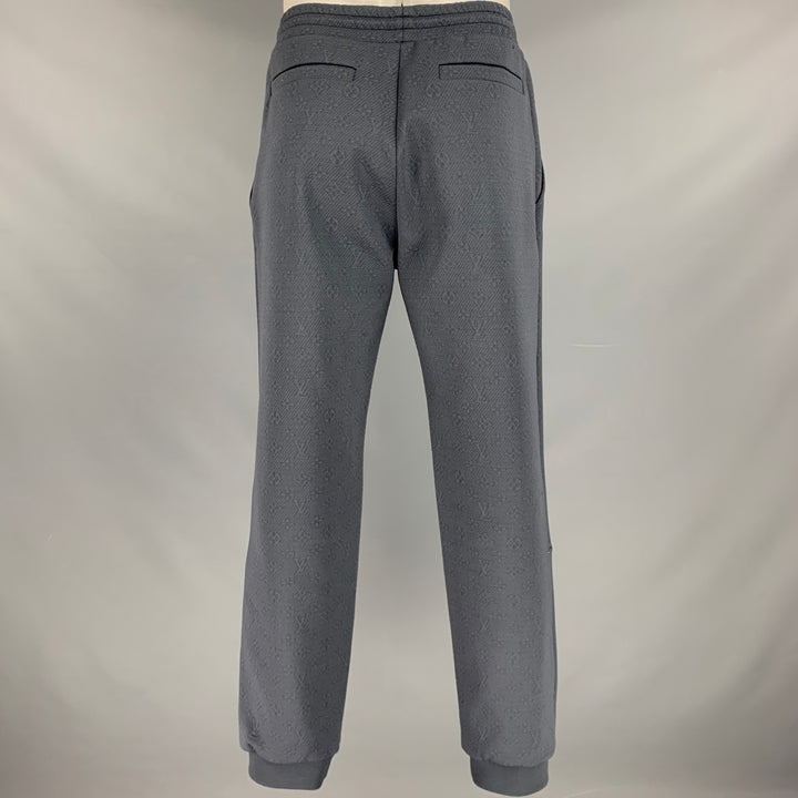 LOUIS VUITTON Talla L Pantalones deportivos de mezcla de poliéster con monograma LV gris Pantalones casuales