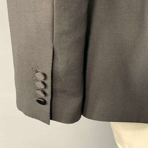 DOLCE & GABBANA Smoking noir en laine vierge et soie mélangées, revers en pointe, taille 48