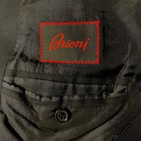 Interior Brioni brand label with red embroidered border.