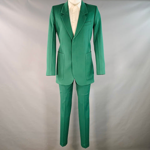 Costume AMI by ALEXANDRE MATTIUSSI en laine verte à revers crantés, taille 38