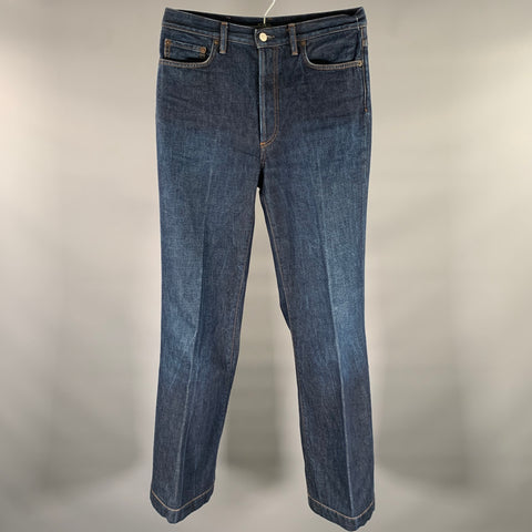 Jeans ACNE taille 30, coupe évasée, en coton, braguette boutonnée, couleur marine.