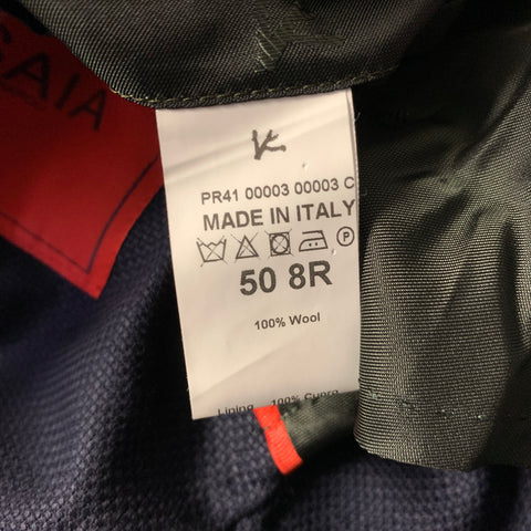 Close-up of care label reading Made in Italy, size 50 8R, and 100% Wool.
