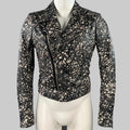 BALENCIAGA motorcycle jacket displayed on a mannequin, featuring a black and white marbled lambskin leather with zip pockets and a zip-up closure.