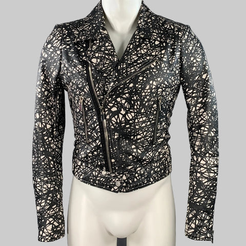 BALENCIAGA motorcycle jacket displayed on a mannequin, featuring a black and white marbled lambskin leather with zip pockets and a zip-up closure.