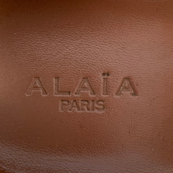 ALAIA Size 9 White Silver Perforated Patent Leather Low Top Sneakers