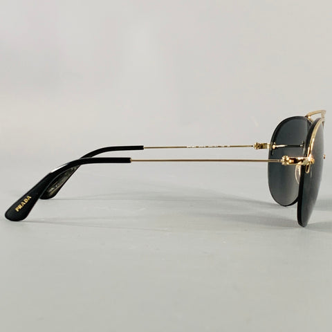 Lunettes de soleil semi-cerclées PRADA en métal doré et noir