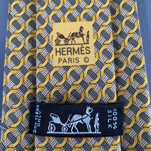 Cravate HERMÈS en soie motif ronds olive doré 7760FA