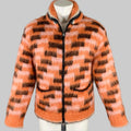 An orange and black faux fur mohair cardigan jacket with a shawl collar, displayed on a mannequin, with the texture of the faux fur visible.
