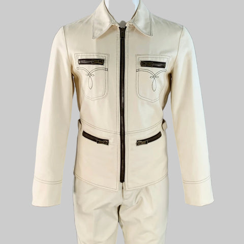 Beige jumpsuit with black accents on a gray background