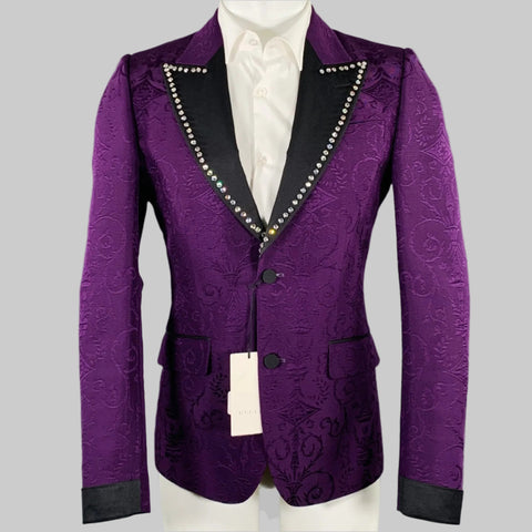 Purple patterned blazer with black trim on a mannequin against a gray background