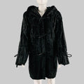 Black textured coat on a mannequin against a gray background