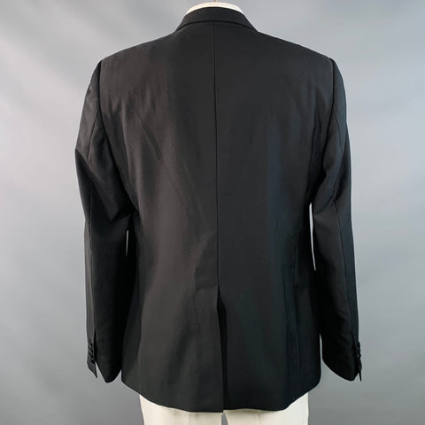DOLCE & GABBANA Smoking noir en laine vierge et soie mélangées, revers en pointe, taille 48