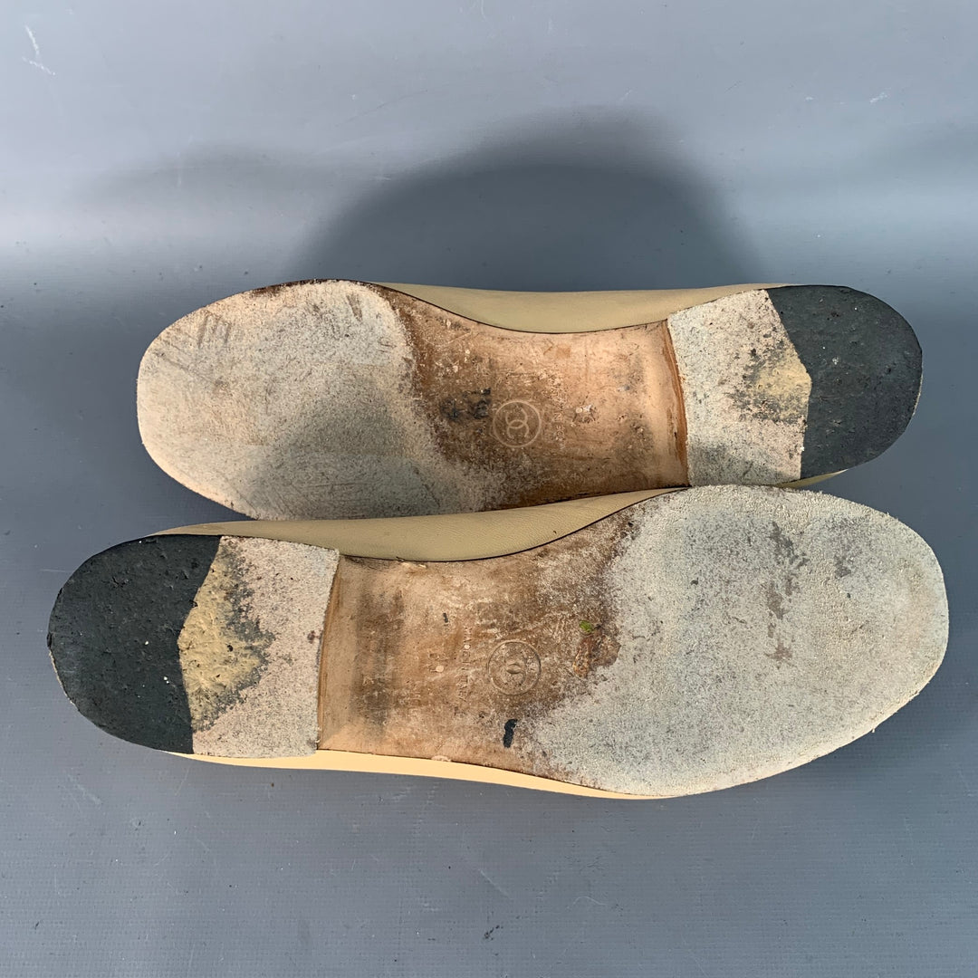 CHANEL Size 9 Beige Black Leather Monogram Cap Toe Flats